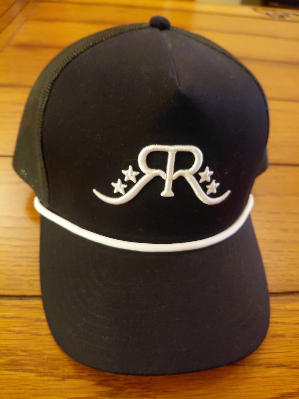 Black Trucker Hat with White Embroidered R and Stars